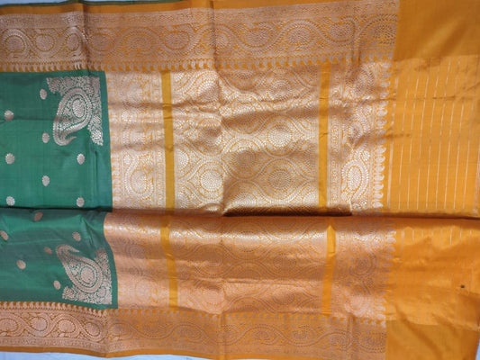 Beautiful tussar Banaras Kaduva butta saree in green with yellow colours