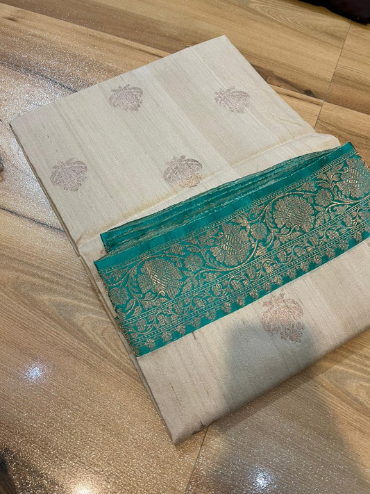 Tussar Banaras Kaduva butta saree in cream with apple green with meenakari