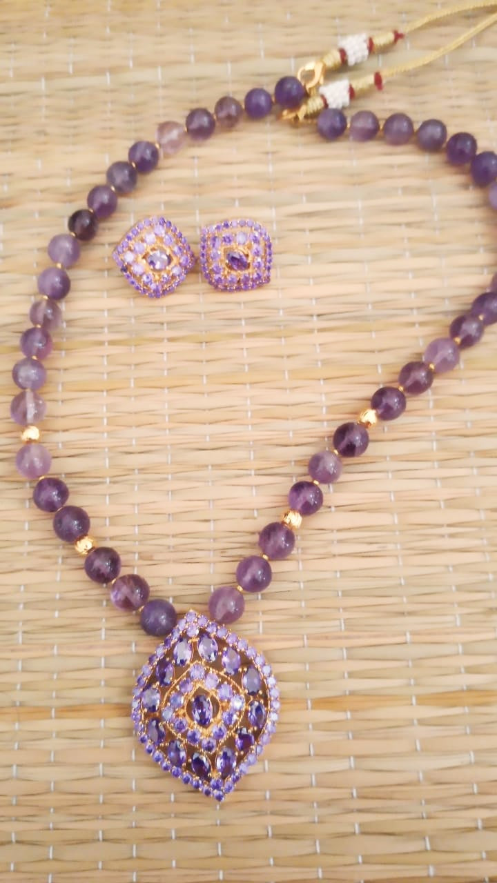 Jewellery violet color stone necklace with earrings in semi precious amythst and ad